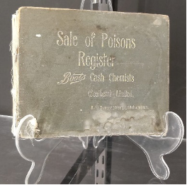 Museum exhibit - old book titled Sale of Poisons Register
