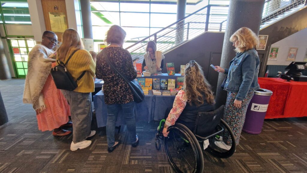 Women looking at book stall